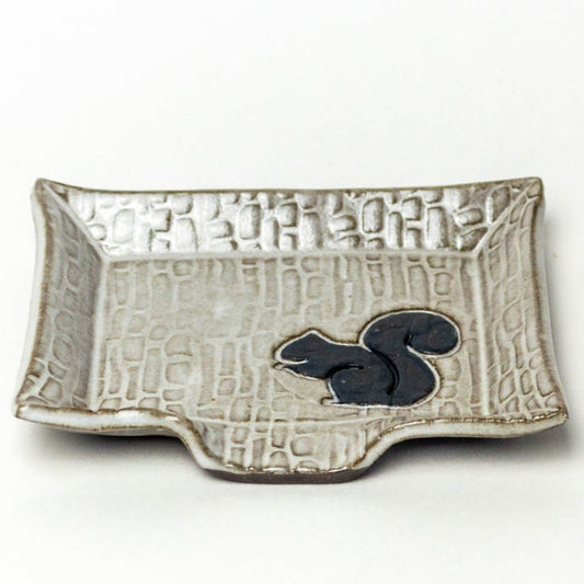 Black Squirrel on White Soap Dish